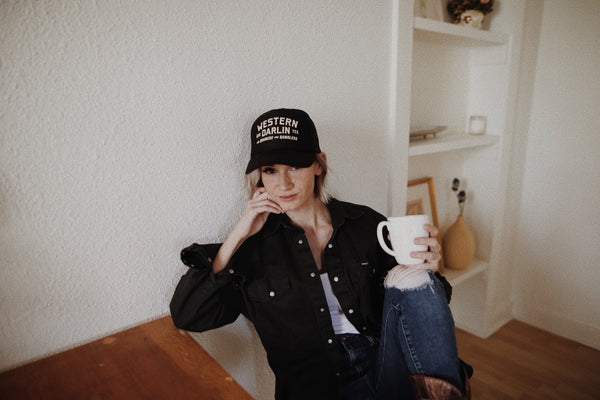 woman sitting holding coffee mug 